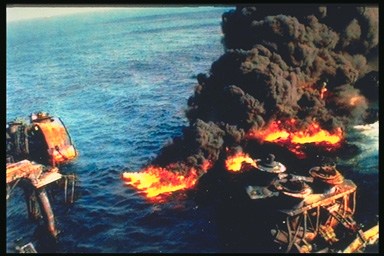 Picture of an off shore drilling location which has caught fire.